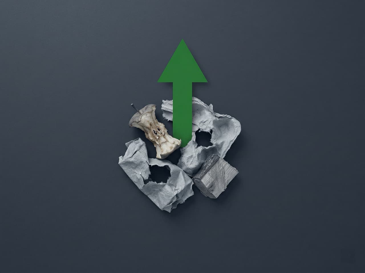 Organic industrial waste materials — food residue, fibrous packaging, wood offcuts — representing the anaerobic decomposition process in landfill that generates methane greenhouse gas emissions