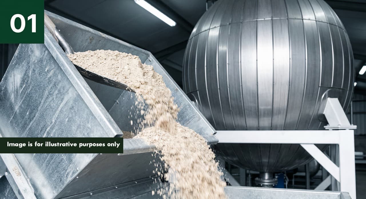 Step 1 of 4: pale buff-coloured dry poultry litter tipping into the PHANTOM input hopper, initiating the 30-minute subcritical water hydrolysis cycle that converts on-farm litter into liquid fertiliser without haulage or AD pre-treatment.