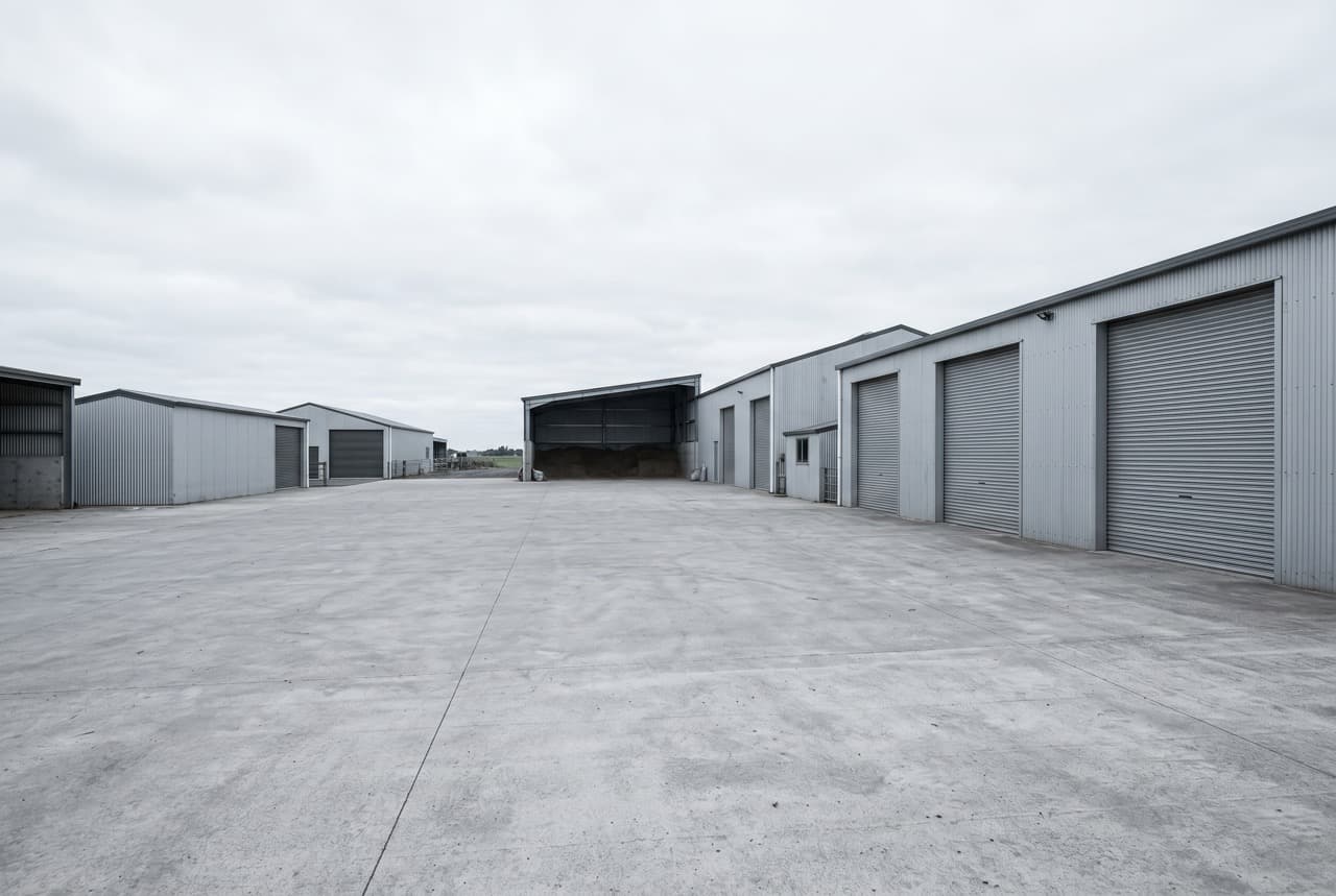 UK farm waste treatment facility showing PHANTOM SWH installation processing organic agricultural waste on-site — liquid fertilizer production at approximately £11–16/tonne operating cost versus £618/tonne for synthetic urea