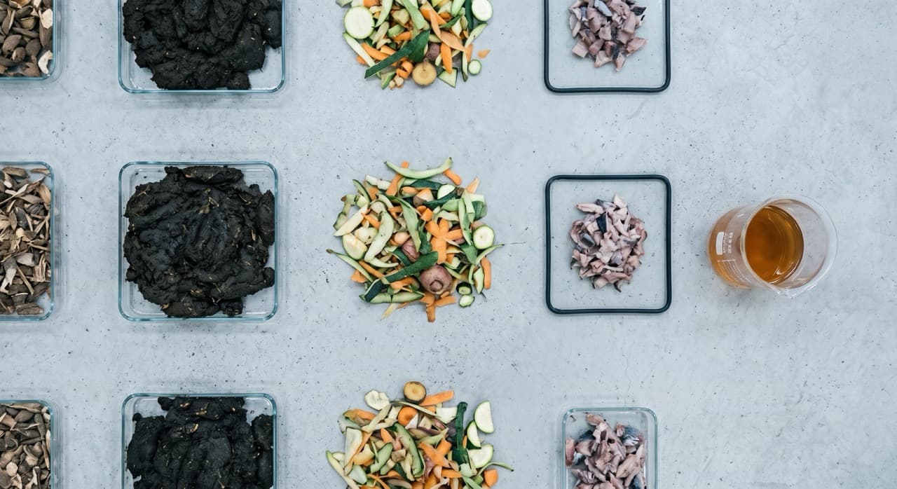 PHANTOM subcritical water hydrolysis system processing organic wet waste on a UK farm — liquid fertilizer hydrolysate output collected for dilution and direct crop application, converting disposal liability to recoverable NPK asset